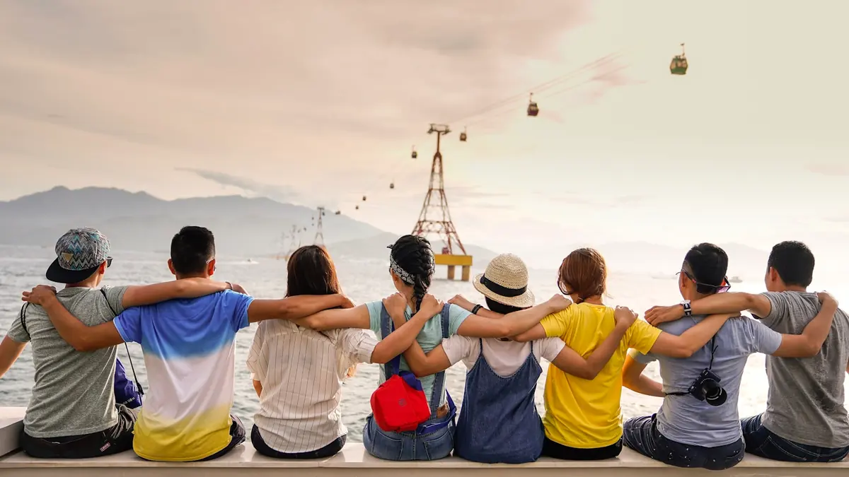 Friends and family of different ages laughing together